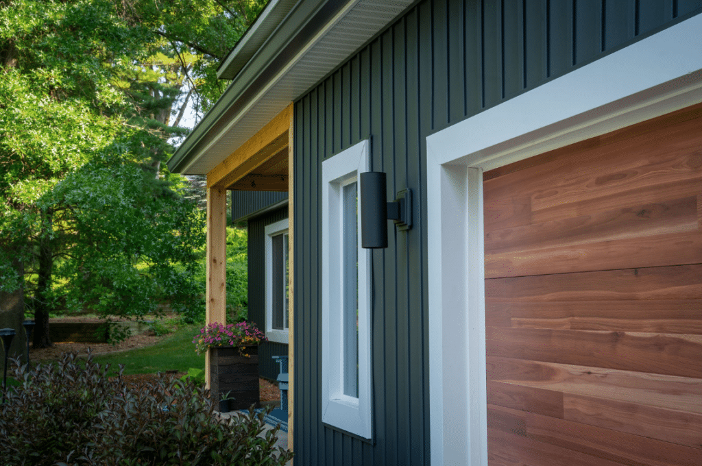 House with modern gray siding with wood accents.